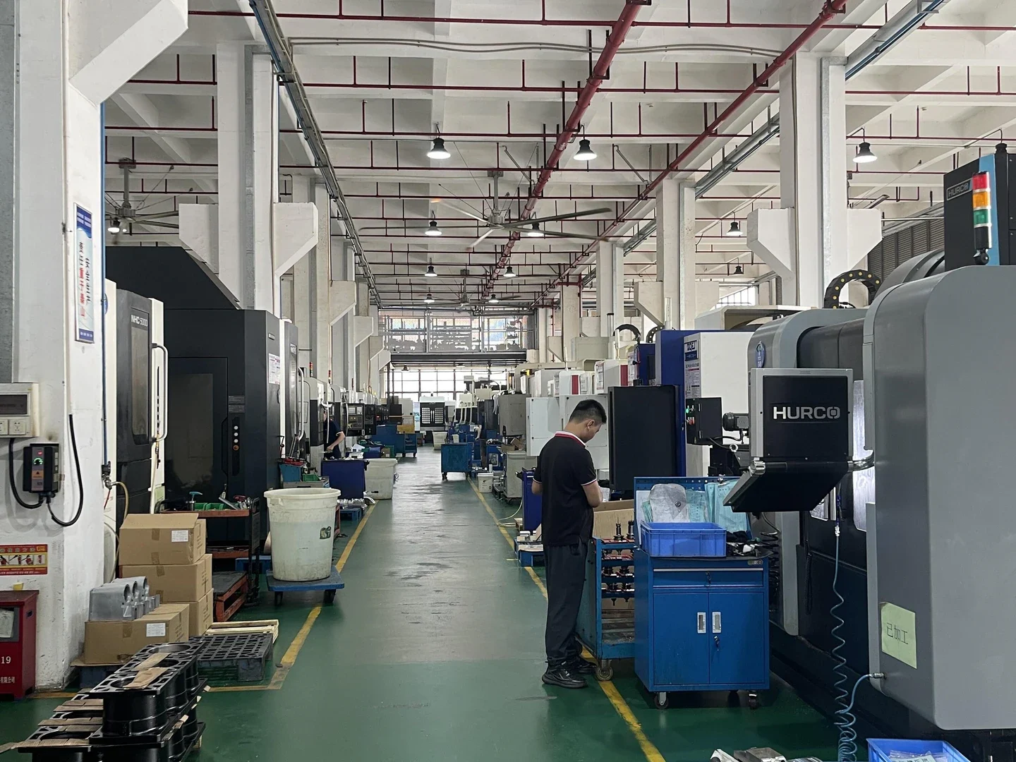 Aisle through a CNC machining workshop