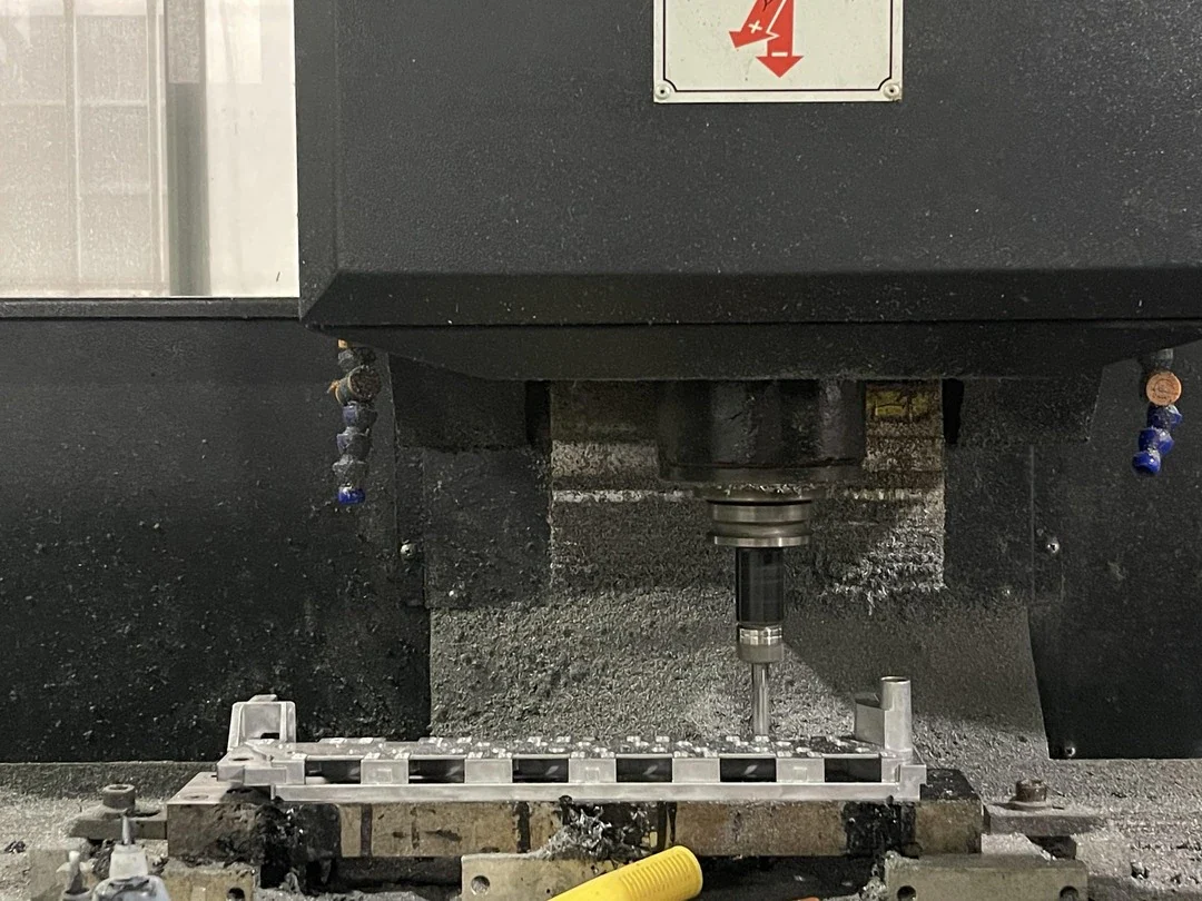 CNC machine cutting a precision component
