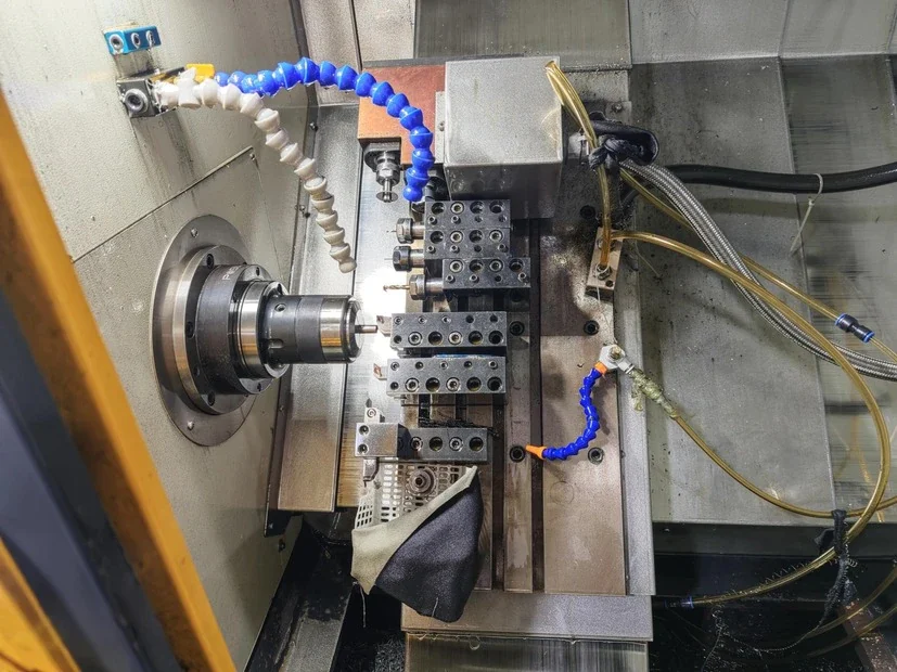 CNC machine cutting a precision component