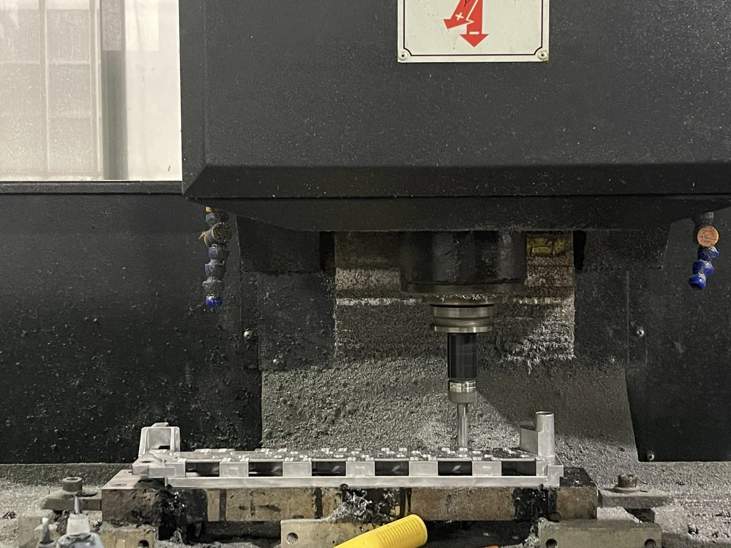 CNC machine cutting a precision component