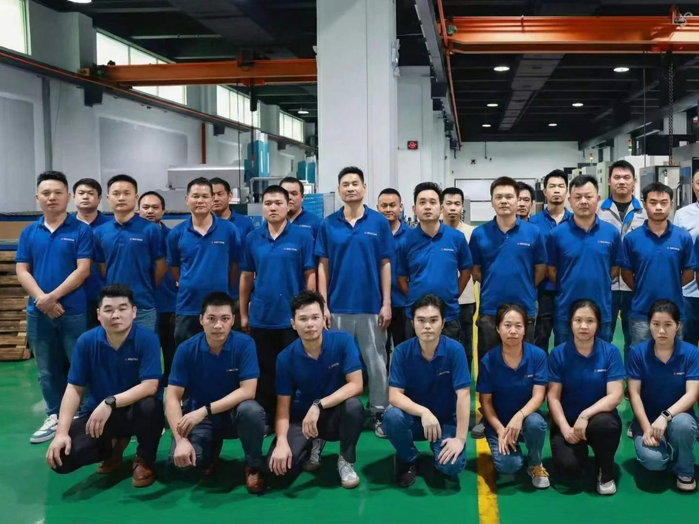 Factory engineering team in a CNC machining workshop