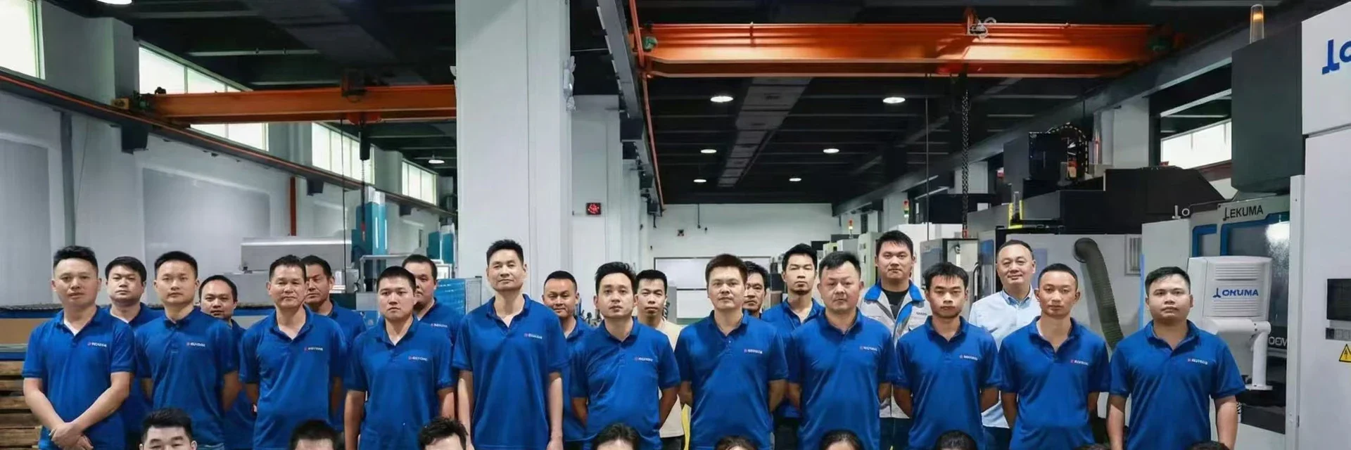 Factory engineering team in a CNC machining workshop