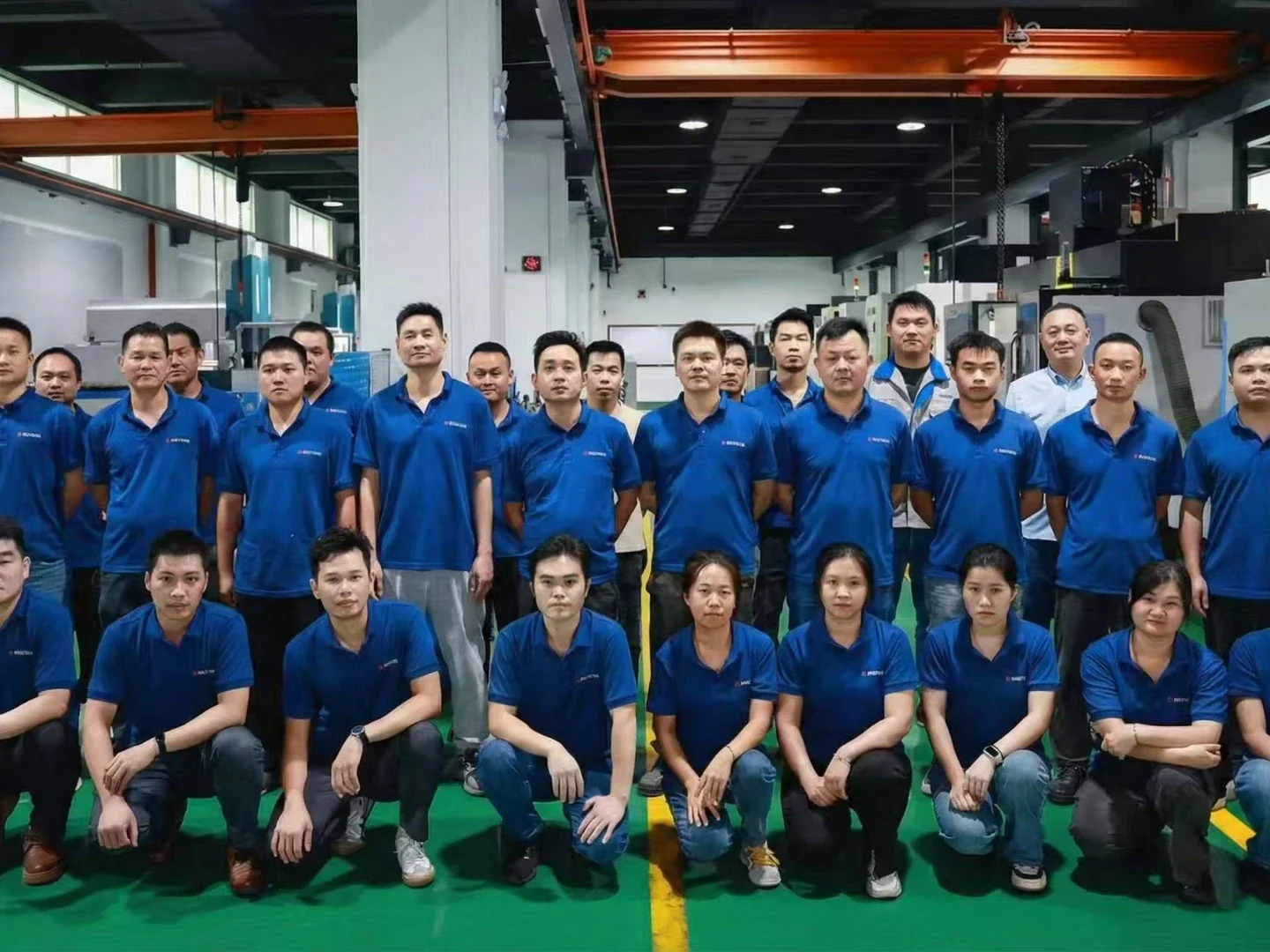 Factory team on a CNC production floor
