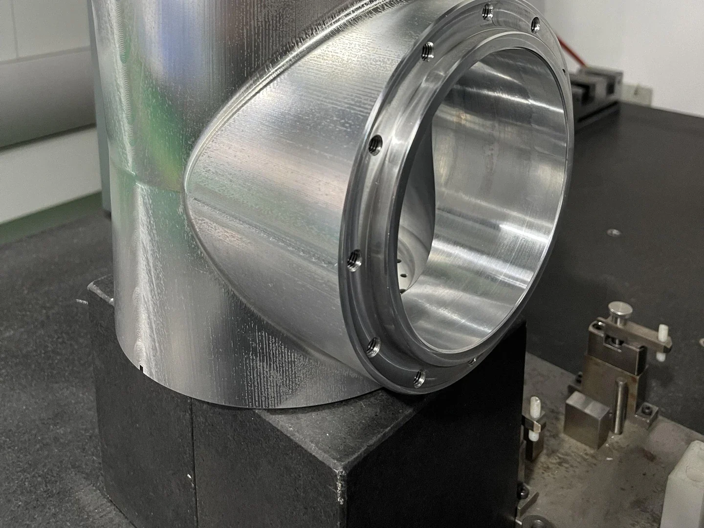 Machined housing staged in a dimensional inspection area