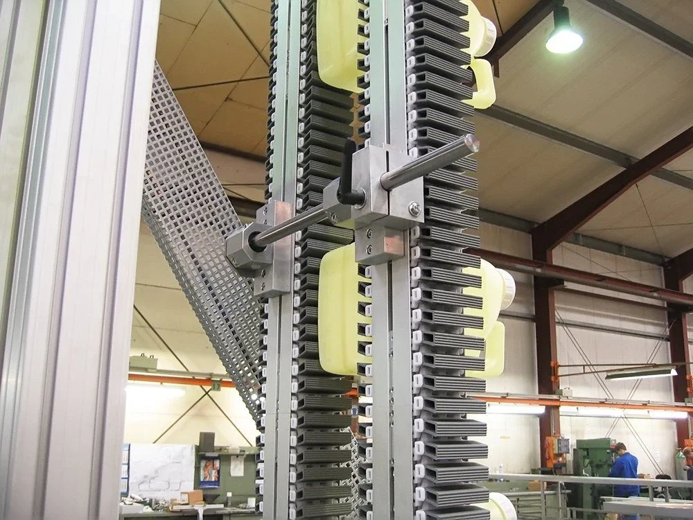 Vertical conveyor equipment with installed guide and support components